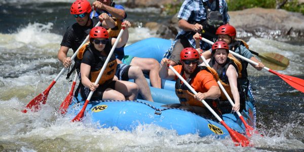 Group of 6 coworkers on a river raft