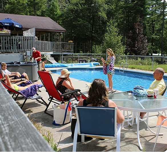 people sitting by the pool